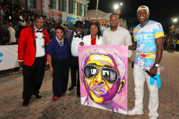 New_Year_s_Day_Junkanoo_-_Minister_Lanisha_Rolle__artist_Jamaal_Rolle__with_Ronnie_Butler_Portrait_1__1_.jpg