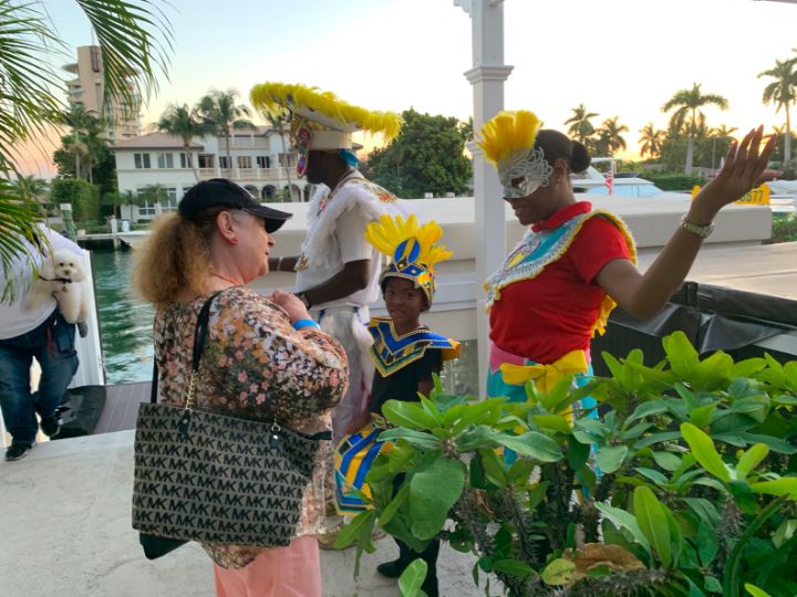 Costumed_Bahamas_representative_Phylia_Shivers_and_other_Junkanoo_models_welcome_guests_to_Bahama_Haus.jpg