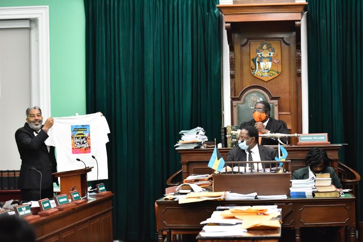 Minister_Campbell_In_House_of_Assembly_-_Displays_Disability_Awareness_Week_T-Shirt.jpg