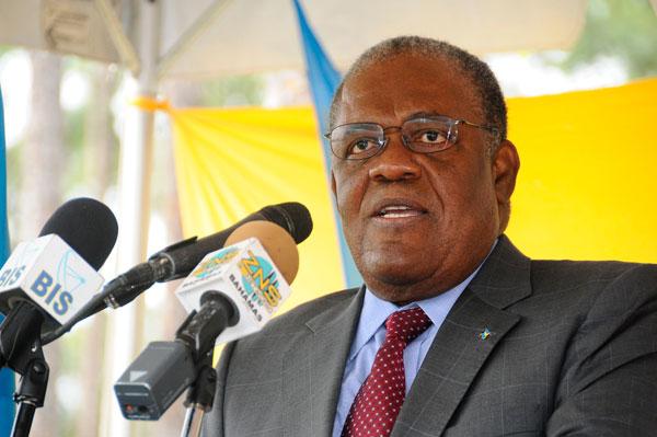 Hubert Ingraham delivers the keynote address at the contract signing ceremony for the new $18 million government complex to be constructed in Freeport by ... - PNE-GBCS_PM